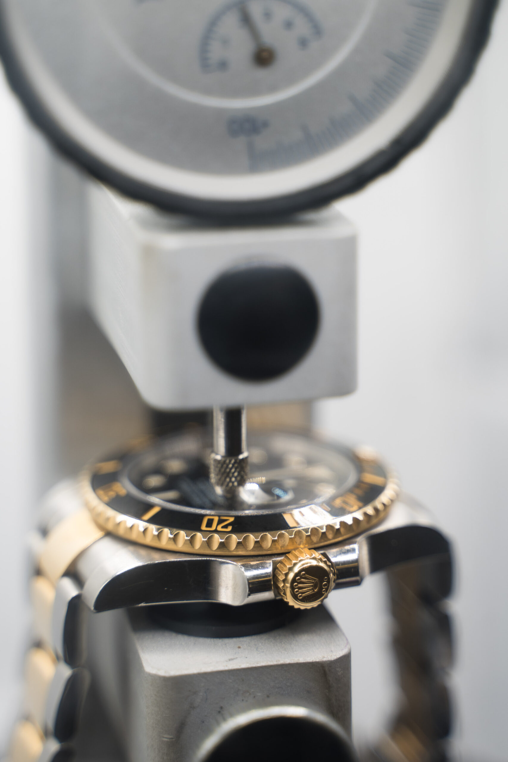 Luxury dive watch undergoing pressure testing after battery replacement and reseal.