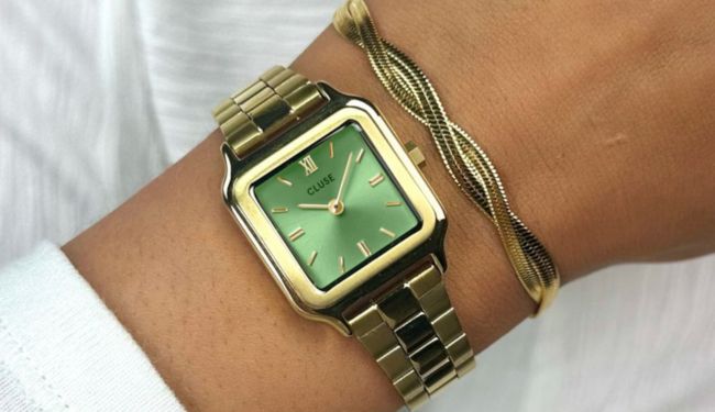 Cluse watch repairs London – Cluse gold square watch on wrist close-up
