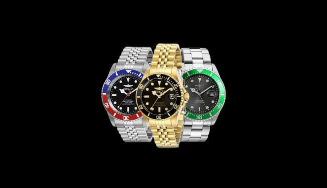 Three Invicta-style watches with coloured dials and metal bracelets on dark background – Invicta watch repair