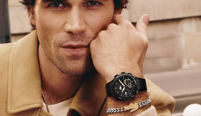 Person wearing a black Lacoste watch on wrist – lacoste watch repairs