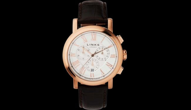 Links of London-style watch with rose gold case and black leather strap on dark background – links of london watch repairs