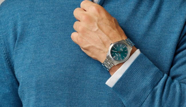 Person wearing a Lorus-style watch with blue dial on wrist – lorus watch