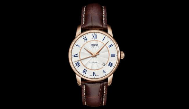 Mido-style white dial watch with brown leather strap on black background – mido watch repairs