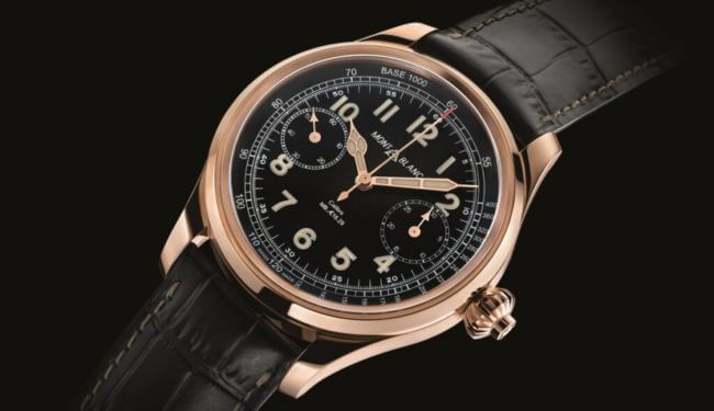 Mont Blanc black dial chronograph watch on black leather strap, angled studio photo