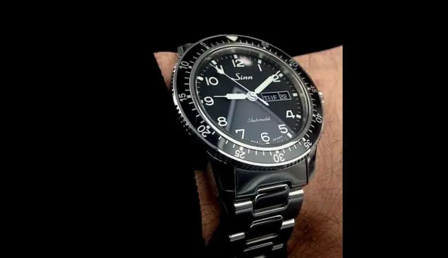 Sinn watch repairs – Sinn pilot-style watch with black dial on stainless steel bracelet