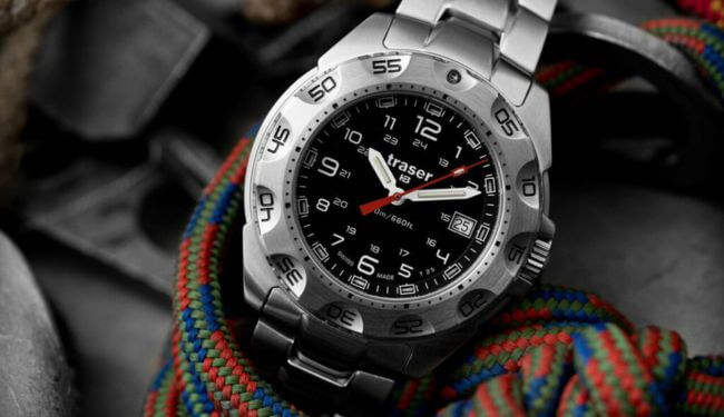 Traser watch repairs – black dial watch close-up on colourful rope