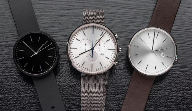 Three Uniform Wares watches laid out side-by-side on leather straps, with black, white and silver dials