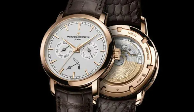 Vacheron Constantin watch repairs – rose gold watch with white dial shown alongside open caseback and movement.