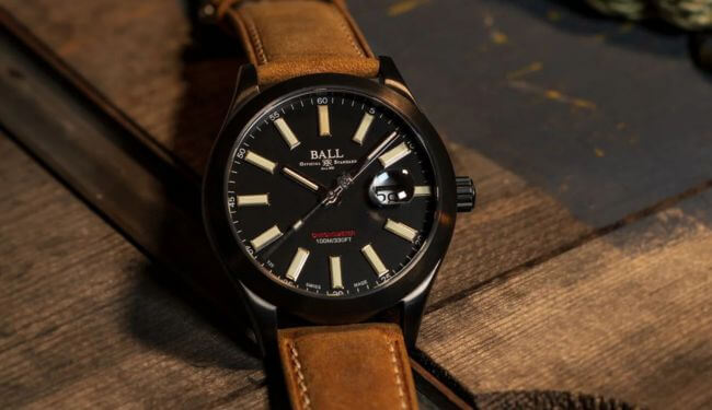 Ball watch repairs in London – black dial watch on brown leather strap