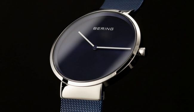 Bering watch repairs in London – minimalist black dial watch on blue strap