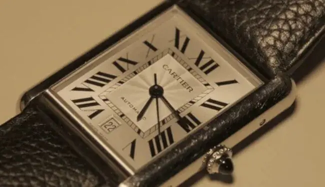 Cartier watch repairs in London – rectangular Cartier watch dial close-up on leather strap