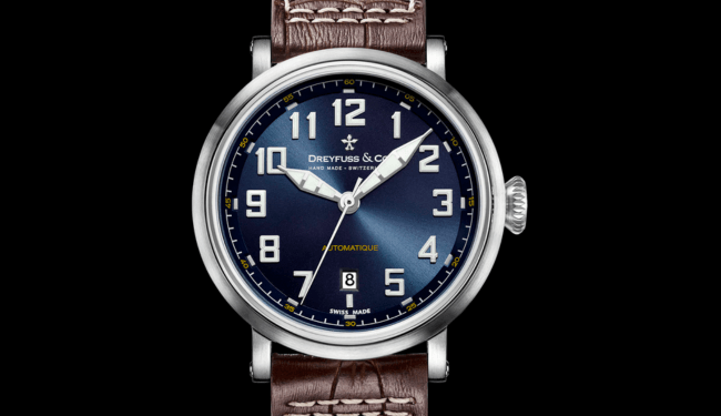 Dreyfuss & Co watch with a blue dial, silver case and brown leather strap on a black background