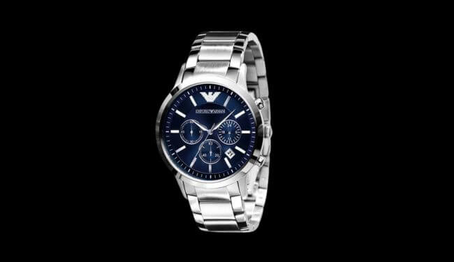 Emporio Armani watch with a blue dial on a stainless steel bracelet against a black background