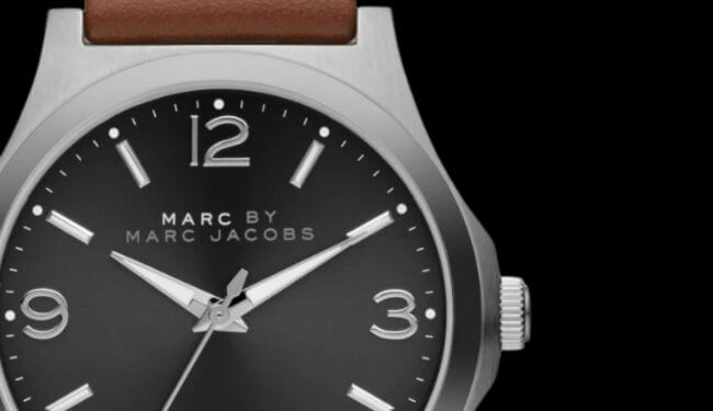 Marc Jacobs watch close-up with black dial and brown leather strap – Marc Jacobs watch repairs