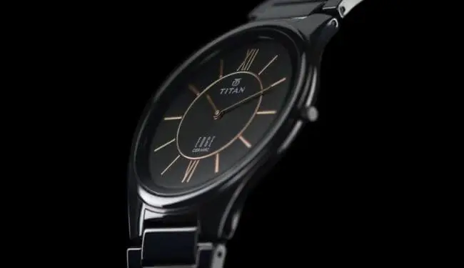 Titan watch repairs – black Titan dress watch with dark dial