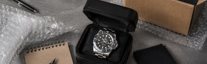 Replica watch packaged securely for postal repair in the UK