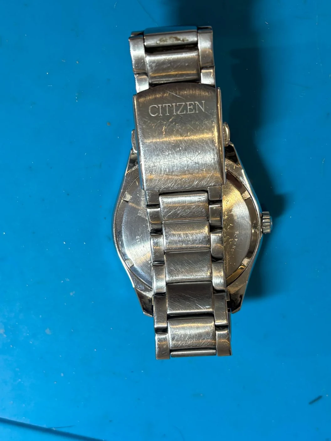 Citizen clasp and bracelet before polishing, showing visible surface scratches