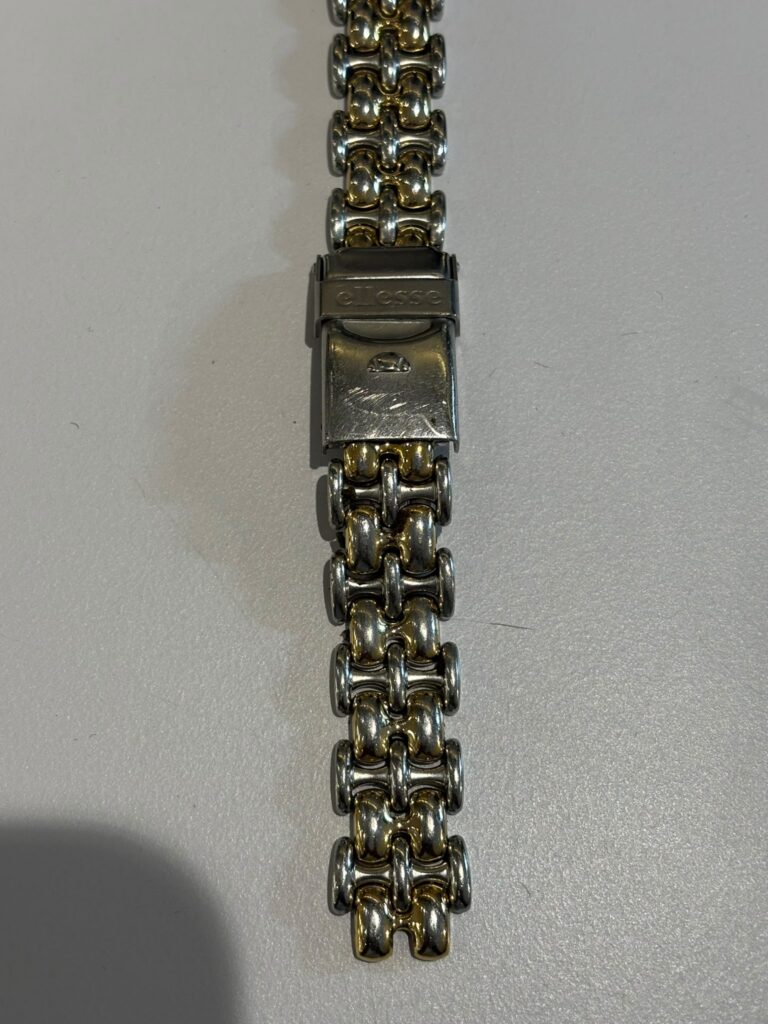 Close-up of Ellesse watch bracelet and clasp during restoration