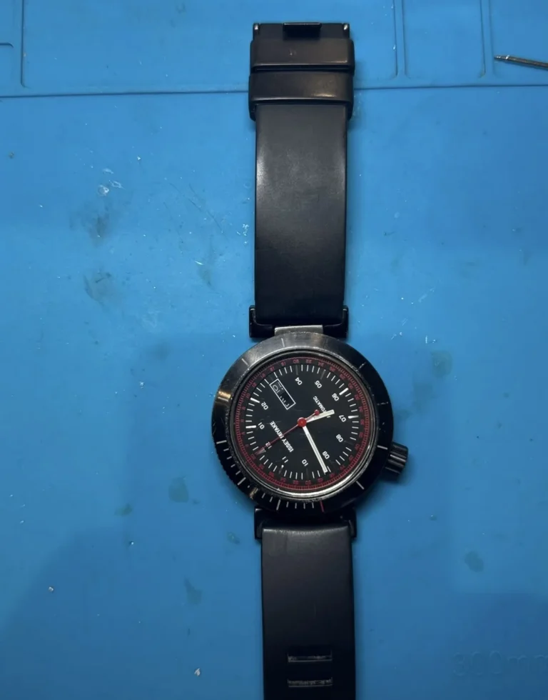 Issey Miyake automatic watch with a displaced dial awaiting repair approval