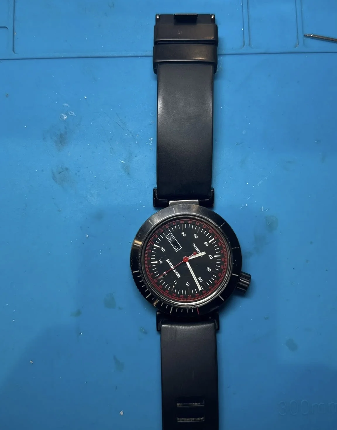 Issey Miyake automatic watch with a displaced dial awaiting repair approval