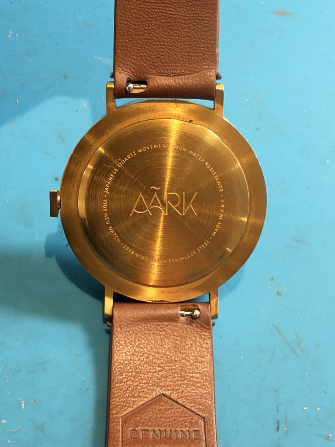 AARK Collective watch caseback showing the Australian design brand and Japanese quartz movement details