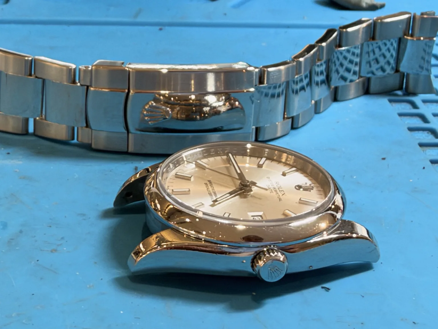 Rolex 115200 clasp and bracelet scratches before repair
